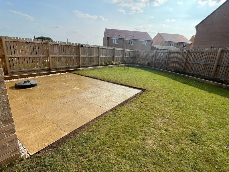 A small patio and raised planters